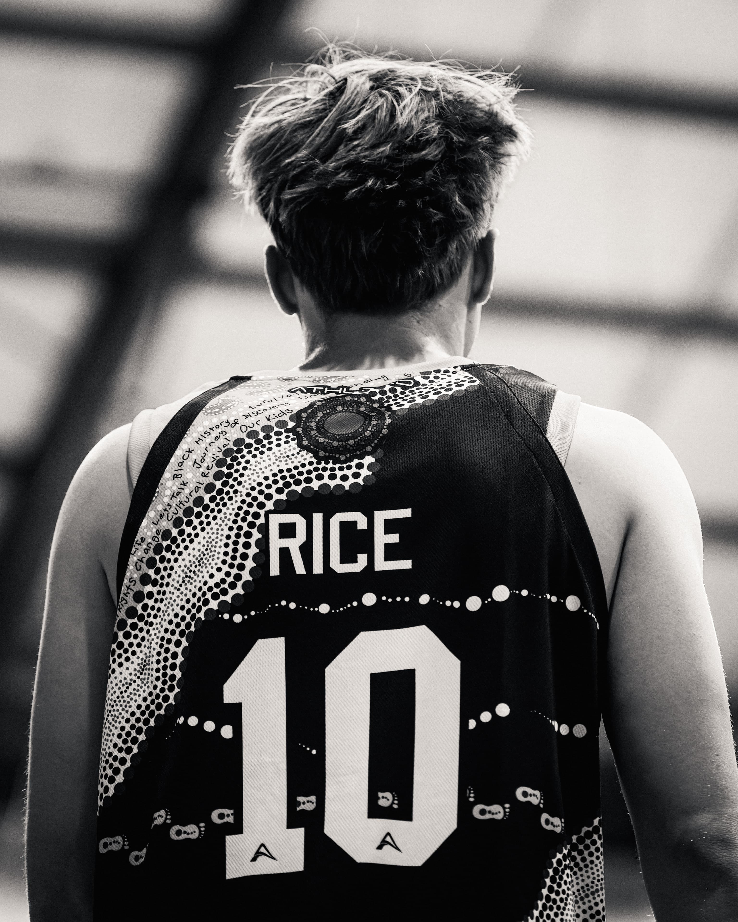 Rice, number 10, walks away with the Indigenous design across the back of his jersey