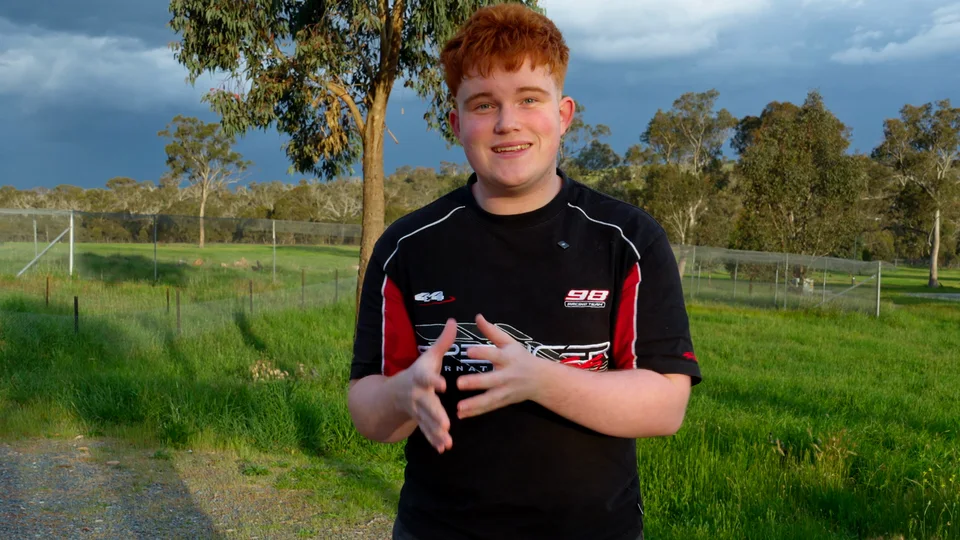 Kian introducing himself outdoors