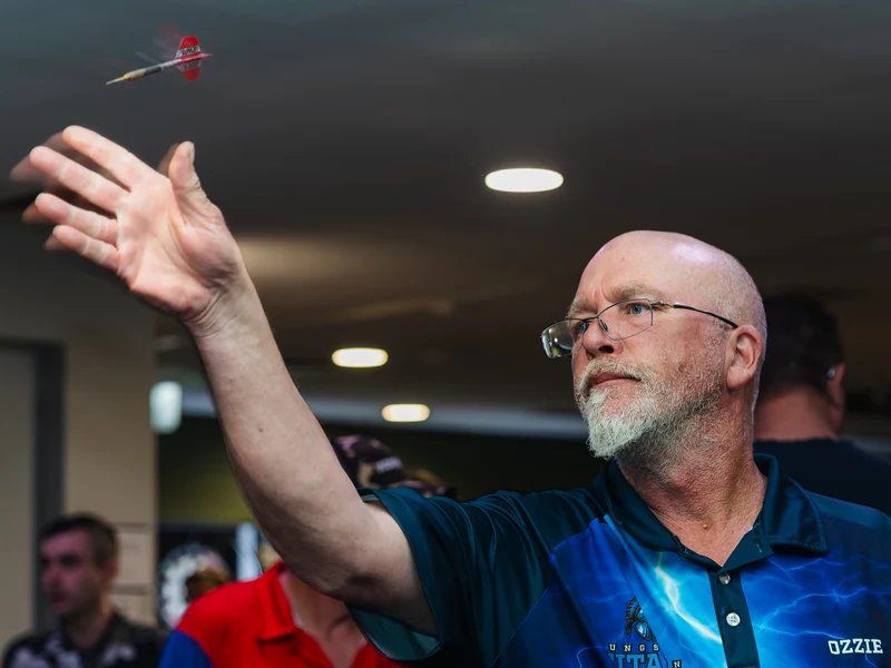 A dart in flight just after leaving a player’s hand