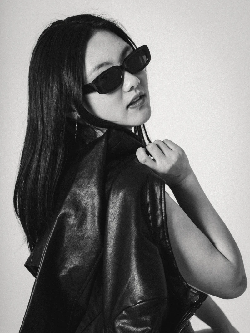 Black and white portrait wearing sunglasses and a leather jacket
